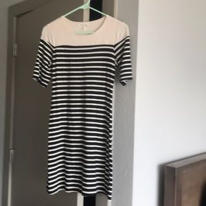 Tight mid-sleeve striped black and white dress.